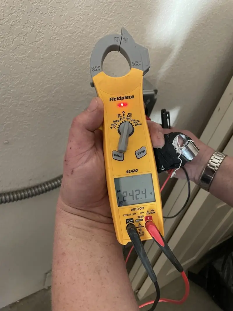 Voltage testing with clamp meter during Electrical Installation Services in Middleville